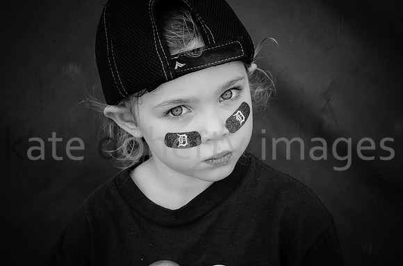 Outdoor on-location little league baseball girl portrait