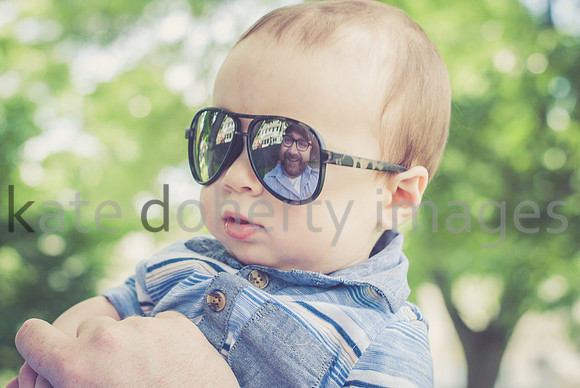 Outdoor on-location reflection portrait baby boy